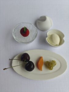 Fruit Dessert with cherries, poached nectarine, strawberry caviar, gooseberry cheong (Korean fruit syrup), and yogurt ice cream with whipped cream