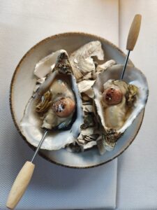 Kys Marine Oyster "L'Étoile" with smoked bone marrow and pine pickle