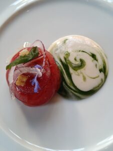 Jouno Tomato stuffed with roasted peach and fermented tomato, served with a peach ponzu sauce.