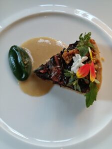 Swiss Chard and Fermented Mushroom Tart with roasted yeast sauce and watercress cream.