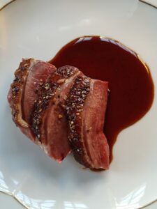 Challans Duck from Maison Burgaud served with crispy skin. Duck and cherry sauce.
