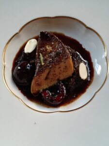 Confit duck leg, pan-fried foie gras, fresh cherries, and almond