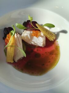 King Fish – Served flamed with plum, dashi, hibiscus, and corn