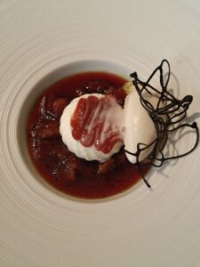 White chocolate mousse with plums and tonka bean ice cream