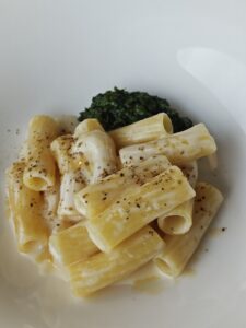 Rigatoni pasta, grilled rocket pesto, ‘Genuss Bunker’ goat cheese, juniper